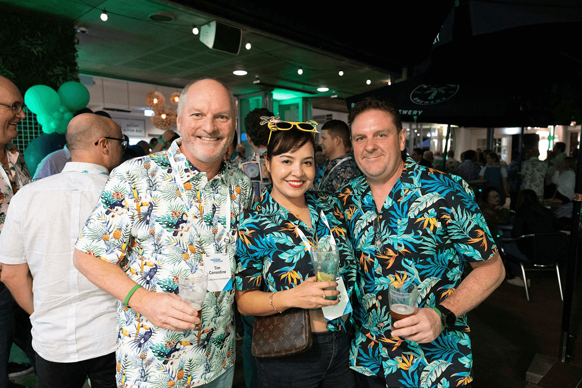 Tim Considine with others having a drink at an event