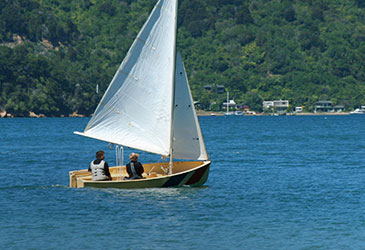 Two people out on the boat going for a cruise