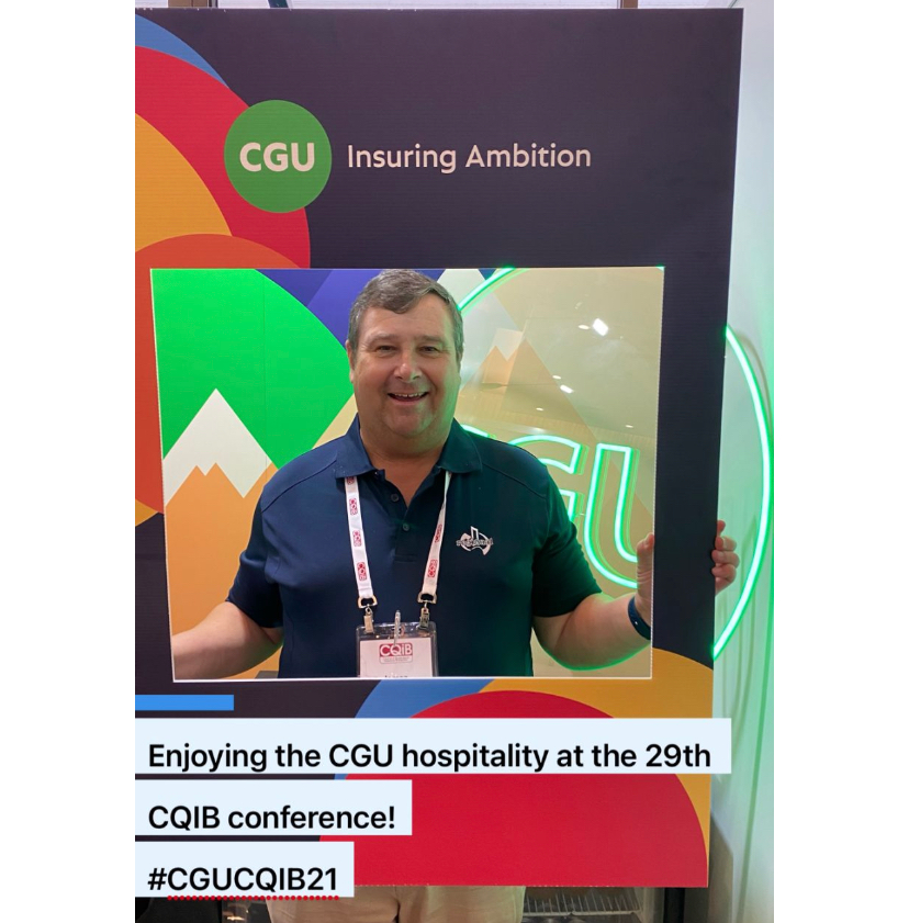 Guy standing by the CGU sign at the CQIB event in QLD