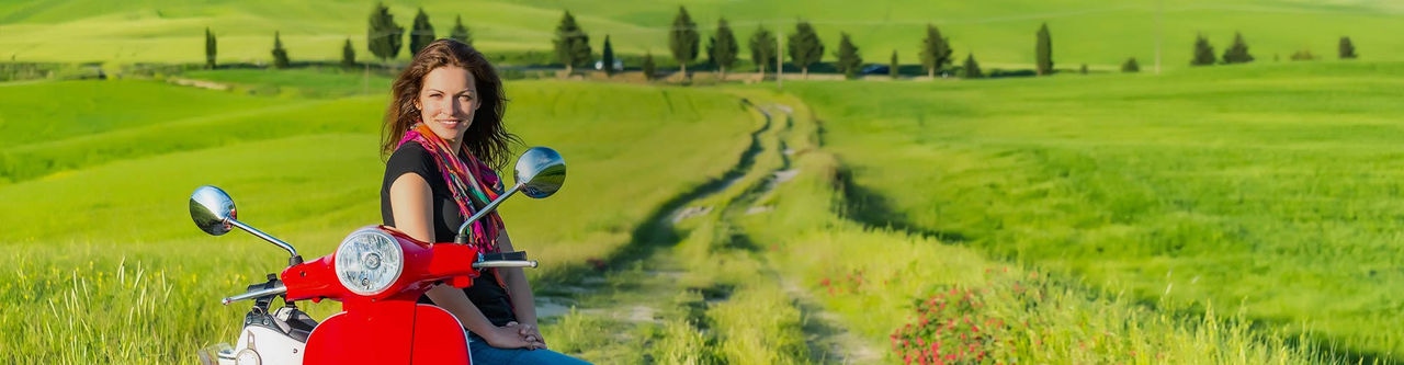 Lady on motorbike in rural area