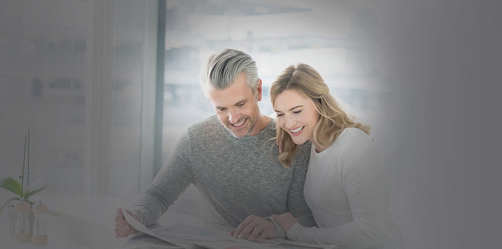 Couple reading newspaper together